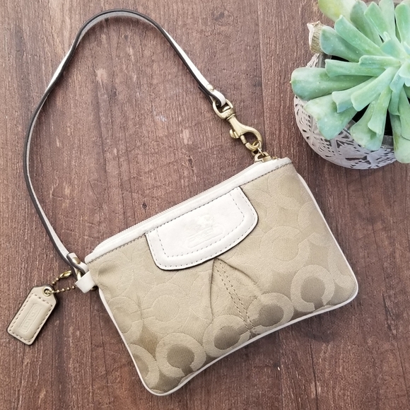 Coach Handbags - Coach Beige and Tan wristlet wallet
